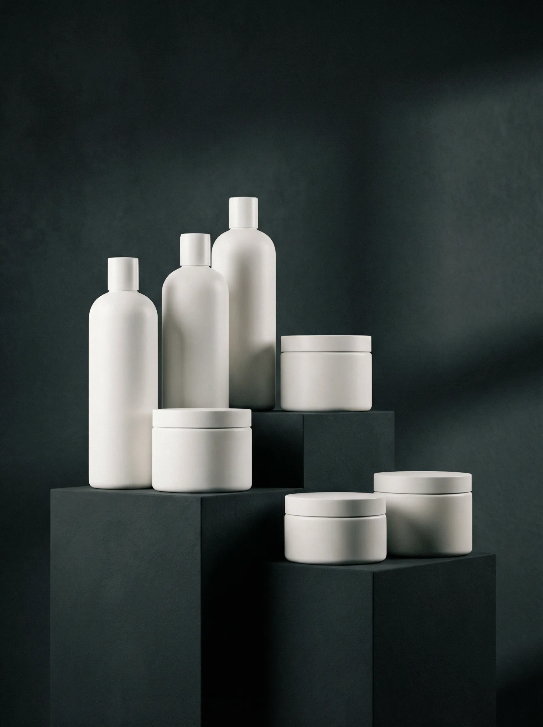 Minimalist luxury shampoo bottles with zero text or labels